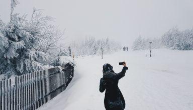 Woman in Snow Field Wallpaper
